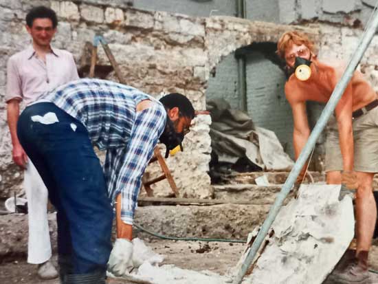 Nick Bateman and Claude moving a heavy lead coffin from the 15th century Guildhall Chapel with Christopher Sparey-Green offering moral support from a safe distance