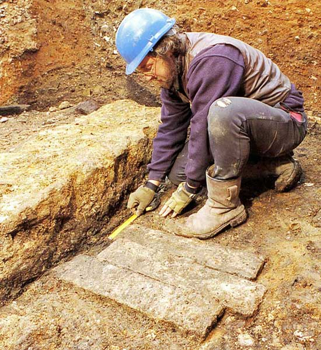 Dave and his leaden ingots on Regis House. The six ingots that underlay these three, Dave dragged home and has been using as doorstops these past thirty years