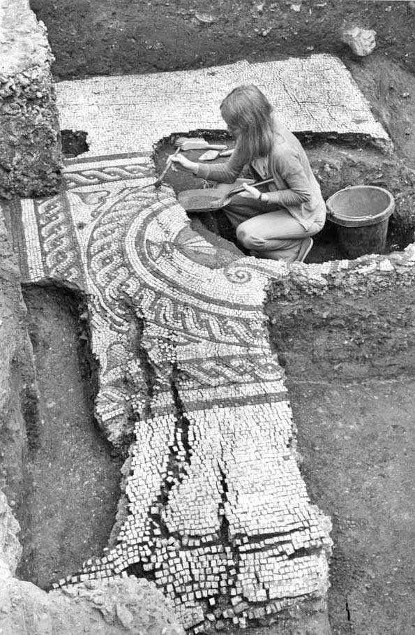 Conservator Marilee Parrott preparing mosaic for lifting. Photo taken by John Bailey